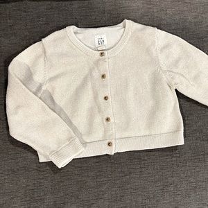 Baby Gap. Cream colored cardigan with gold thread and buttons.